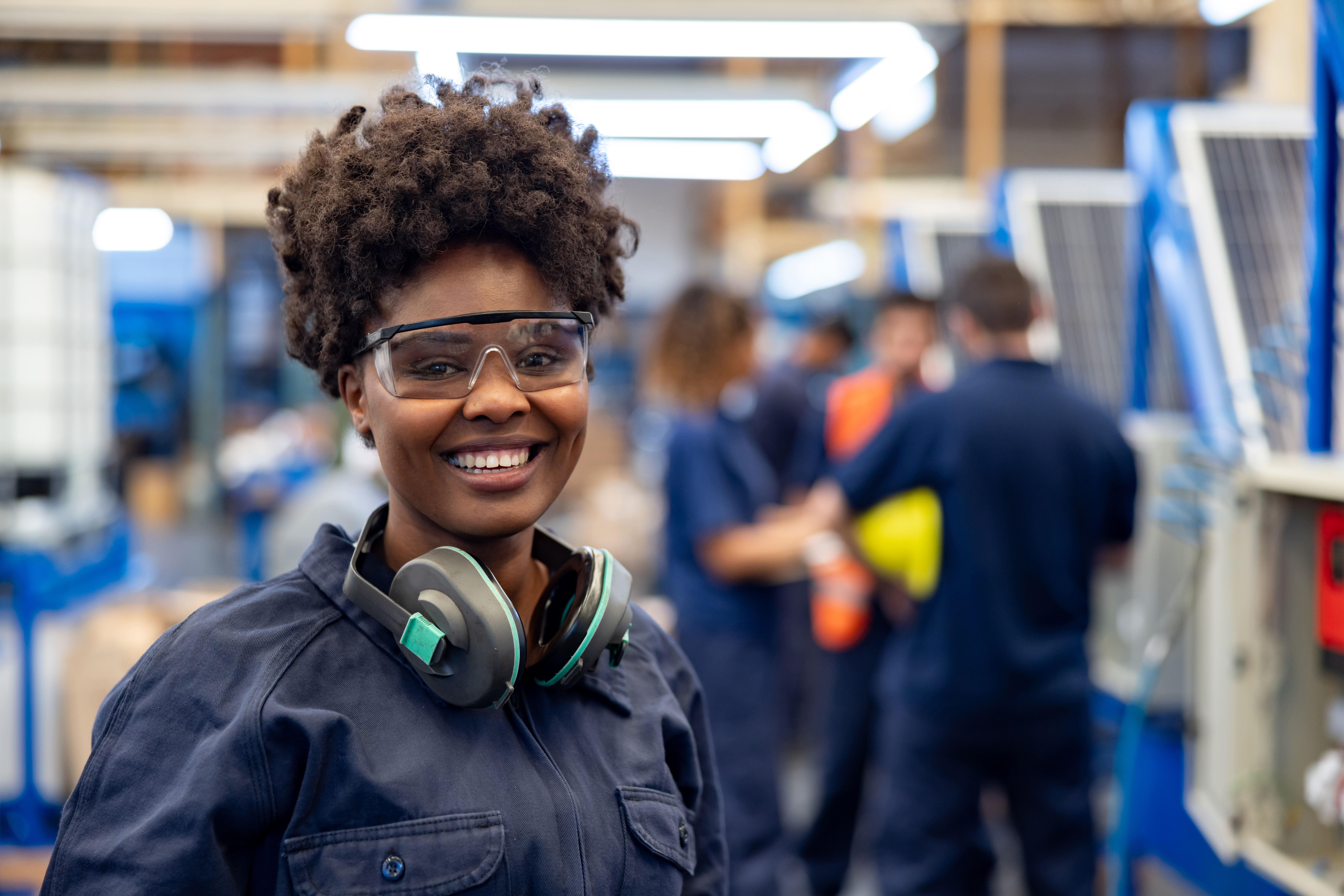 Woman working in a manufacturing plant.