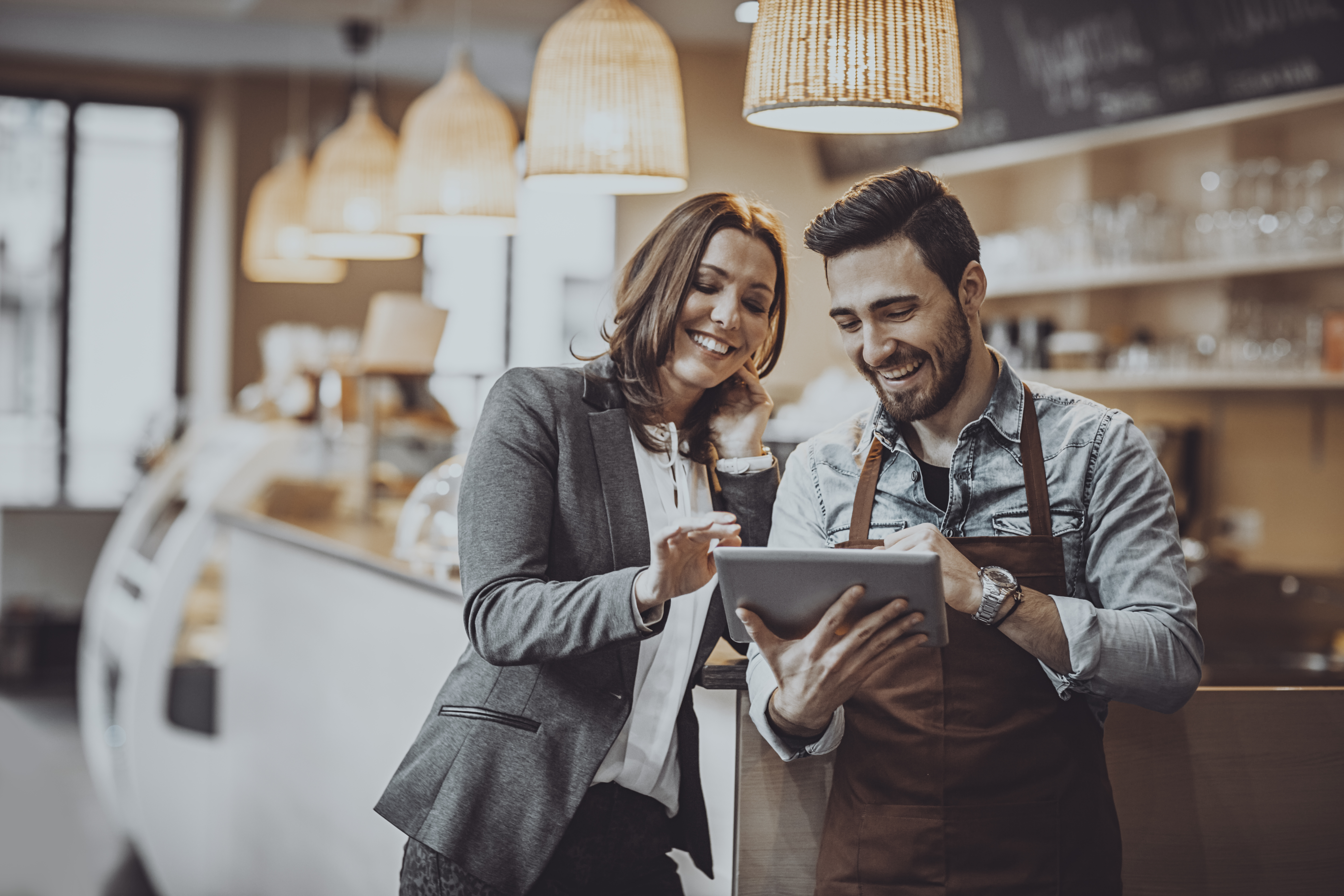 Caterers looking at a tablet