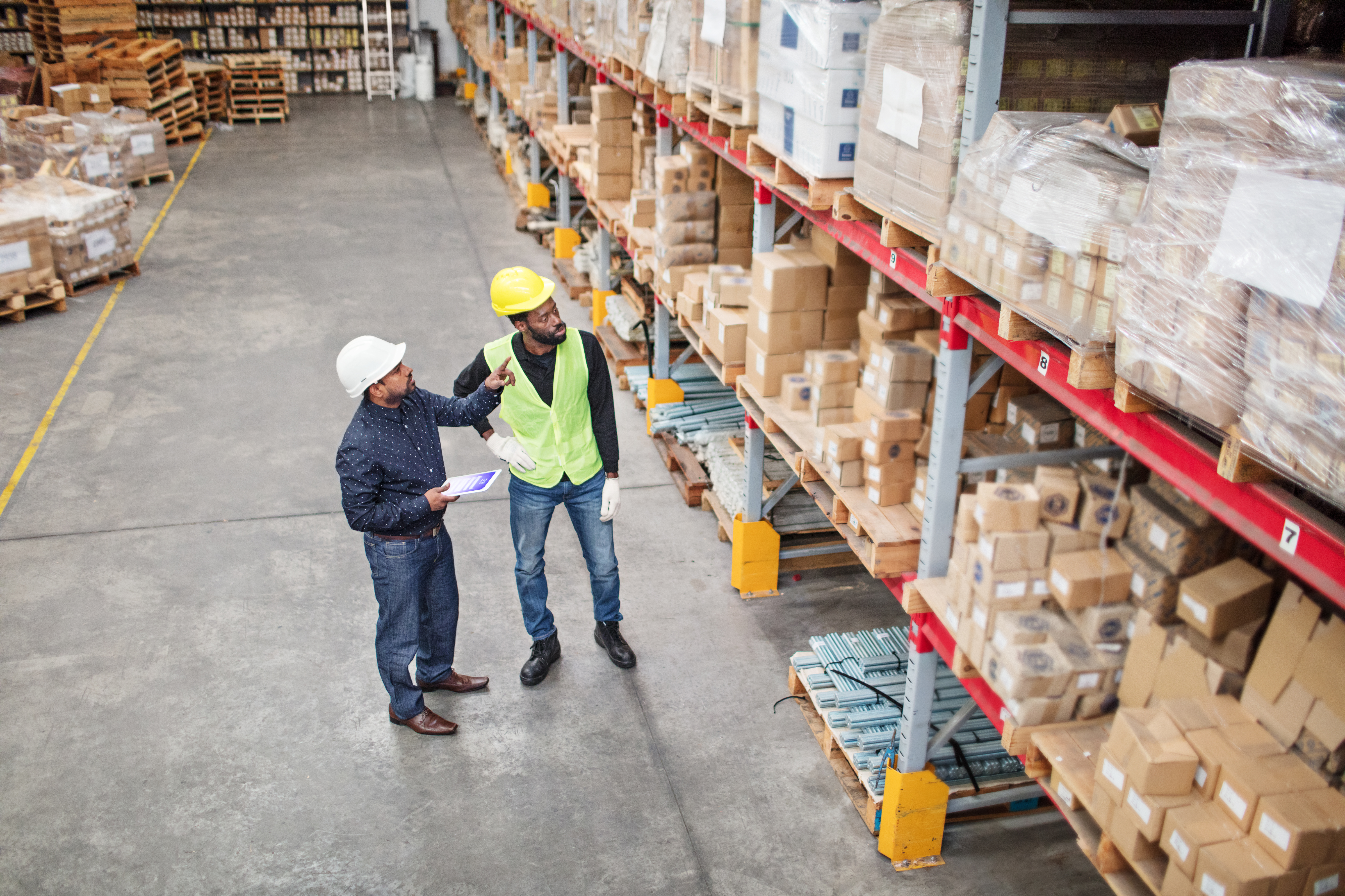Warehouse workers looking at inventory